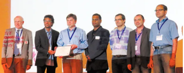 Figure 5. from team ORION); and cochairs of HRATC 2014: Raj Madhavan (chair, RAS SIGHT and vice From left, Raja Chatila, RAS president; Sandesh Gowda and Dan Popa (winners president, RAS Industrial Activities Board), Lino Marques, Edson Prestes, and Prithviraj Dasgupta.