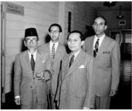 Foto yang diambil pada tanggal 17 Januari 1948 di dek USS Renville (kanan ke kiri): Perdana  Menteri Amir Syarifuddin, Setiadjit, Johannes Leimena, H