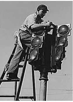 Figure 2.1: The installation of a traffic signal in San Diego in December 1940 