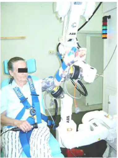 Figure 2.1: A two arm robot assisting patient in range of motion exercise [13] 