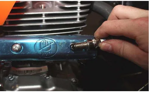 Figure 1: The typical way of a motorcycle user to check the spark of spark plug  (Geobikes.com) 