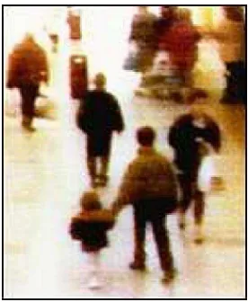 Figure 2.2: The two-year-old Jamie Bulger being led away by his killers, recorded on 