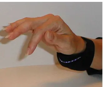Figure�3.14,�and�demo�session�at�http://www.lightglove.com/�demofr.htmthat�requires�the�user�to�wear�a�device�on�the�underside�of�his/her�wrist.�Light�from�the�device�(visible�or�)�is�a�new�human�interface�device�infrared)�scans�the�palm�and�senses�wrist,�hand�and�finger�motion.�This�data�is�translated�into�either�on)screen�cursor�control�or�key�closures�and�in�addition�works�as�a�long�distance�on/off�switch�for�virtually�all�electronics.�Wireless�operation�offers�cordless�freedom,�thereby�reducing�the�occurrence�of�repetitive�strain�injuries�such�as�carpal�tunnel�syndrome.�