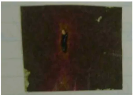 Fig. 6. Green paper at entrance of deflection tube displayed beam shape after beam on for 3 seconds