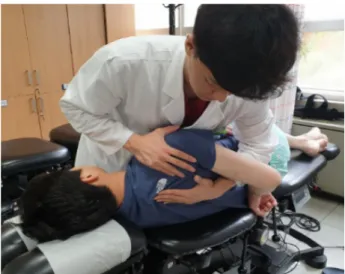 Fig.  1.  Joint  mobilization  therapy  on  glenohumeral  joint  in  the