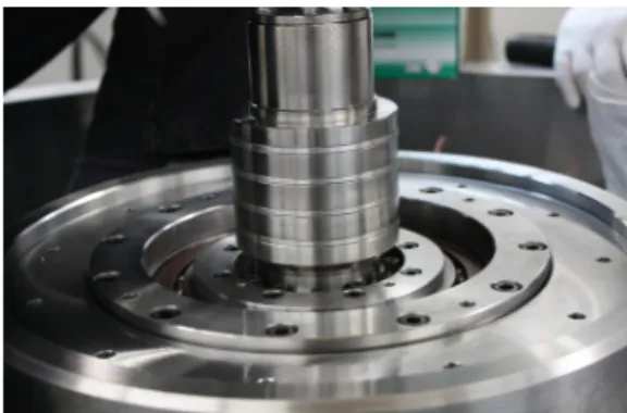 Fig. 3. Rotor of 35 kWh superconductor bearing. 이때  평가에  사용된  초전도  단결정  벌크는  Sm seed를  이용한 YBCO(23*28*12 ㎣)로  제작  되었으며  자기  플럭스가  균일하게  주입될  수  있도록   직경 88.8 mm, 표면자장 0.5T인  Nd-Fe-B  영구자석을  이용하여  회전자를  제작  하였다 
