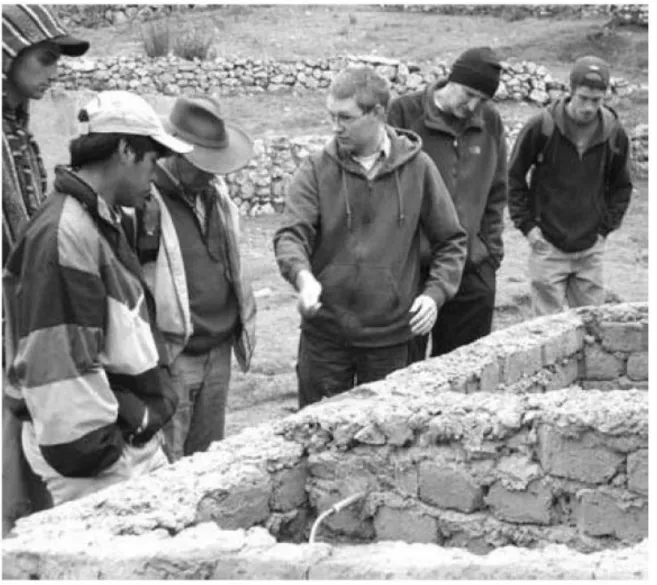 Figure 1.2 A chemical engineering student from Brigham Young University talks to villagers in Peru about a fuel system that students are installing in their village (courtesy of Jeff Ashton).