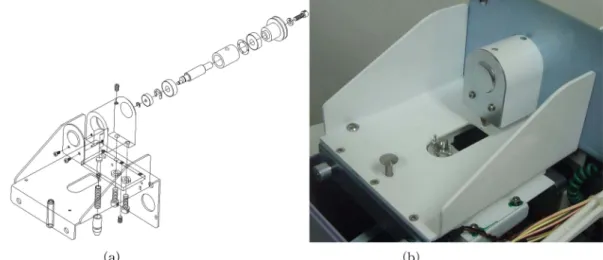 Fig. 5. The (a) assembly drawing and (b) photograph of the housing part installed in the upper body of the auto pattern maker.
