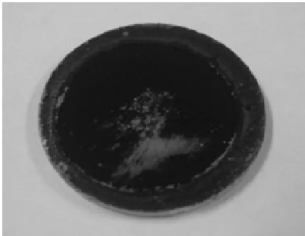 Fig. 7 Photograph of surface of Pd/ZnO-BaZr 0.85 Y 0.15 O 3  mem- mem-brane after methane direct cracking process