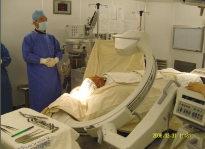 Fig. 4. Intraoperative use of C-Arm :The C-Arm which was positioned to take the zygomatic arch.