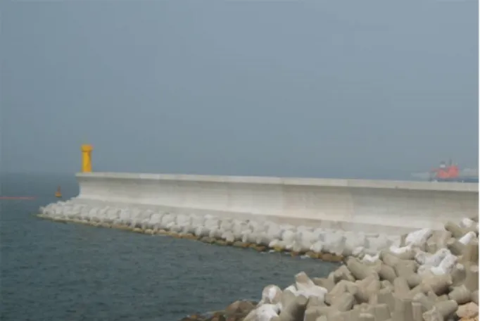 Fig. 1. Example of sea dike having low mound and high wave wall (Sea dike of Hwa-am wharf in Ulsan).
