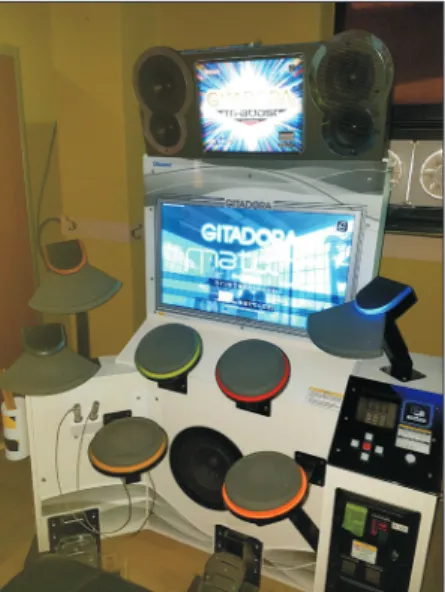 Fig. 1.  A rhythm game which is called as GITADORA. Fig. 2.  Simple radiographs of the left thumb in a 26-year-old male patient