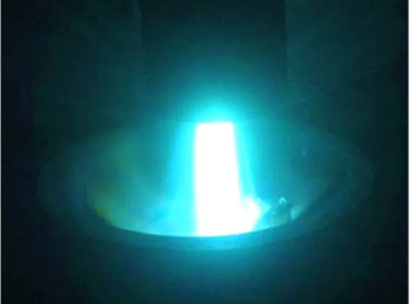Fig. 3. A photogarph showing the plasma flame and plasma torch in plasma arc remelting process.