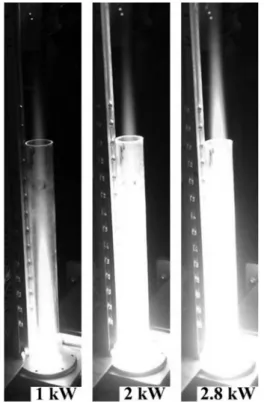 Fig. 3. Profiles of simulated optical emission of OH radicals around 309 nm represented by the solid curve in comparison with the experimental emission data (open circles), estimating the gas temperature to be T = 5000 K.