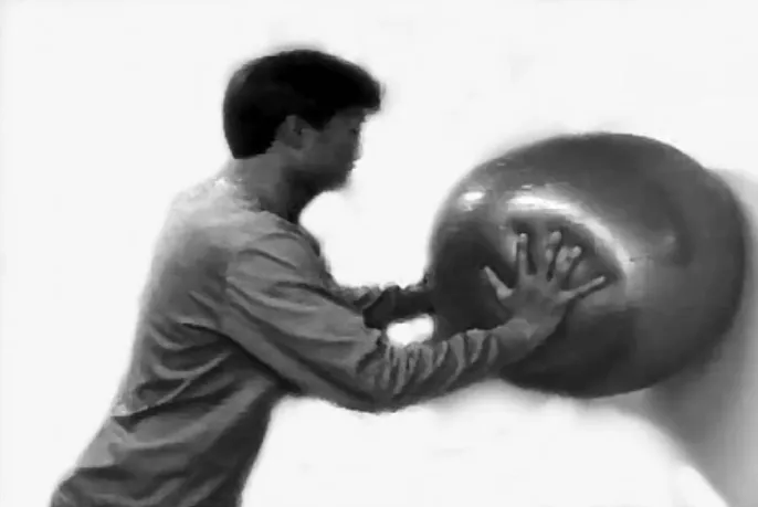 Fig. 5. A plyometric exercise drill: a one-handed throw with use of a thera-band.