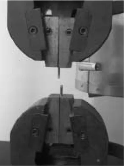 Fig. 2. Slotted holding device for specimen and tested solder joint bar