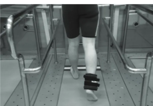 Fig. 1. Underwater treadmill walking training after  wearing underwater cuff