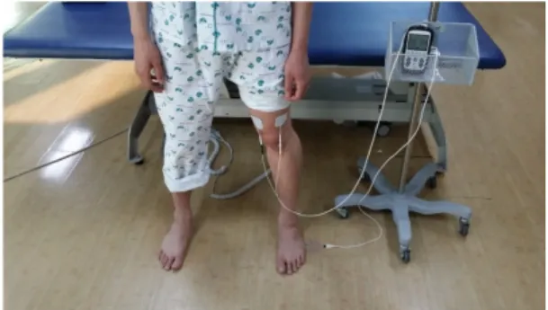 Fig.  1.  Weight  shift  training  with  electrical  sensory  stimulation  feedback