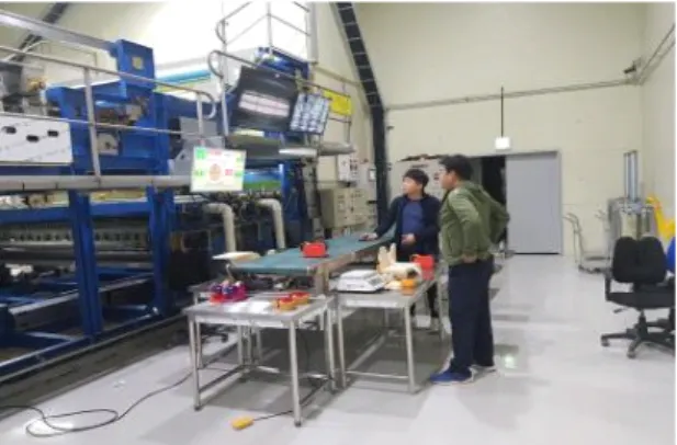 Fig.  12  Demonstration  of  remote  control  system  and  seaweed  weight  control  device 