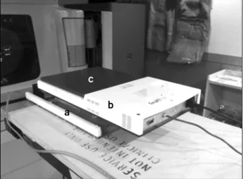Fig.  1.  Moving  phantom  consists  of;  (a)  Moving  platform,  (b)  I’m  MatriXX,  and  (c)  Solid  water  phantom