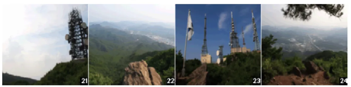 그림 통신탑 송신탑 및 전망대 풍경[2-14], 해돋이 전망대에 다가갈수록 대전시의 남부를 차지하고 있는 동구의 도시화된 모습과 삼형제봉 만인산 등으로 뻗어 나가는 산줄기가 힘차며 해발고도,, 570m 대를 유지하는 이 구간은 숲으로 들어서서 마냥 걷다가 갑자기 나타나는 산정부의 풍광에 매료되고 마는 산행의 묘미를 한껏 느낄 수 있음, 피뢰침처럼 아득히 보이던 송신탑이 손에 잡힐 듯 가까워지며 바위덩어리 위에, 태극기가 꽂혀있는 이곳은 해돋이전망대임 - 