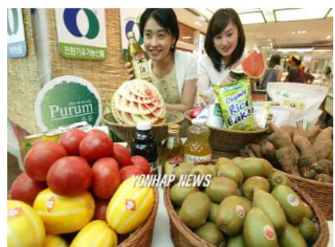 Fig. 4 Women looking at some fruits at