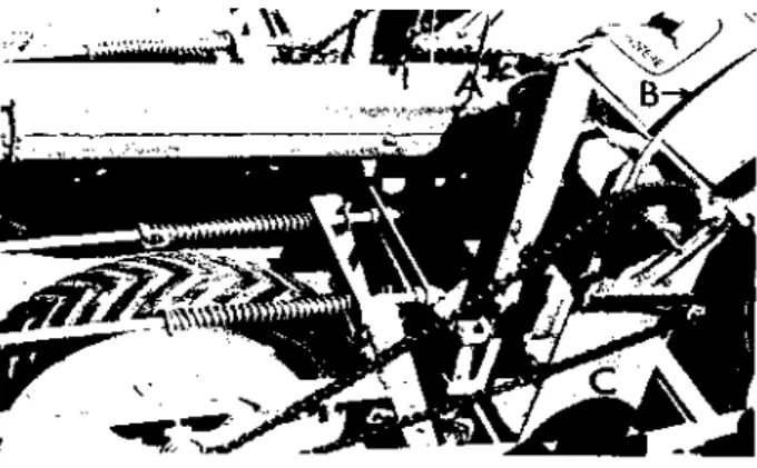 Figure 1.—(Top). Modified planter assembly in operating position; A: 