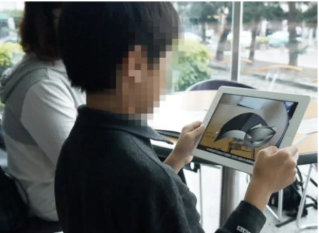 Fig. 1. Demonstration of the use of the AR picture book in this study.