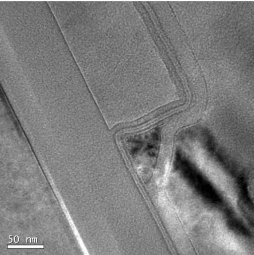 Fig. 2-4    TEM pictures of double-gated SONOS with 180Å-thick top gate oxide. 