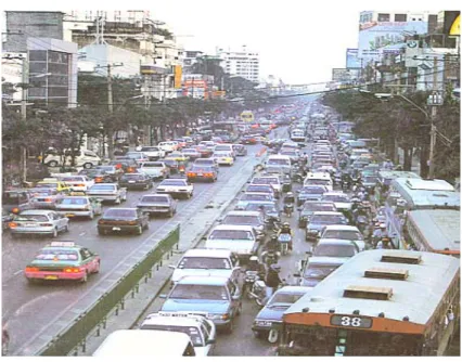 Figure 3-1. Erratic motorcyclists’ behaviors in congested urban traffic, such as  sneaking into traffic jam and transverse crossing between two  adjacent still vehicles