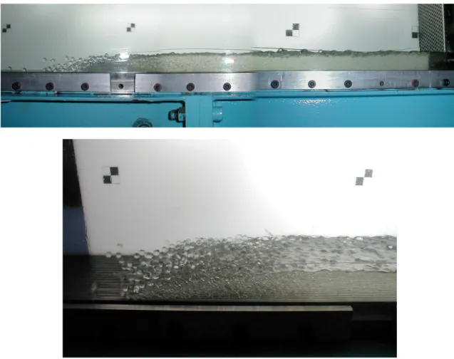 Figure 13. Granular-liquid surges observed in the double recirculation flume. The flume is inclined  and the belt operated at large speeds to make the downslope surge stationary with respect to the  laboratory frame of reference