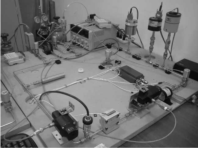 Figure 4: Dual-Tank Accumulation System for measuring the minute flowrate of gas flow through microchannels.