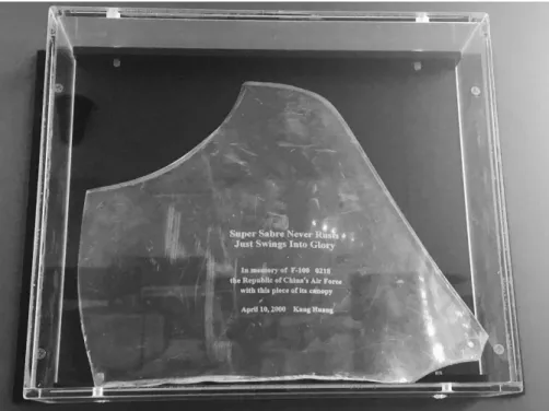Figure 1: A shattered piece of the canopy that was part of the retired F-100 NTU received in 1989 is  displayed at the Gallery of NTU History