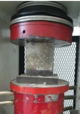 Figure 13: Compressive strength test set-up of the geopolymer concrete cube. 