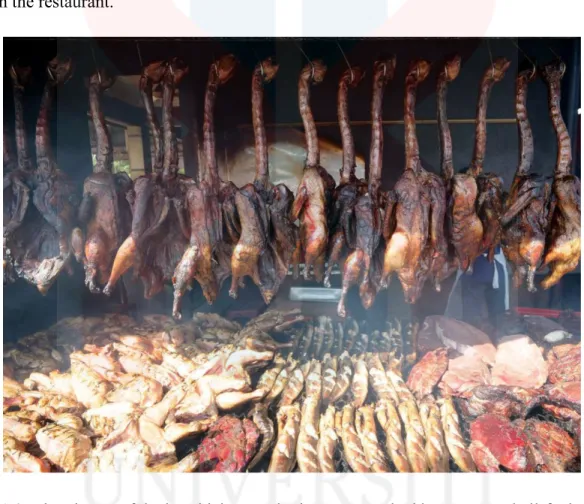 Figure 1.0: The picture of ducks, chicken, and others are smoked by coconut shell-fueled fire  At Itik Salai Mashtar Restaurant, duck meat is smoked for 2 hours so that it produces  a unique smell and has a distinctive aroma that is not the same as grilled