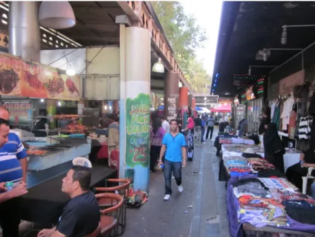 Figure 3. Food and clothing dominate the flea market trade. In this picture, we can see  the food court beside the clothing stalls