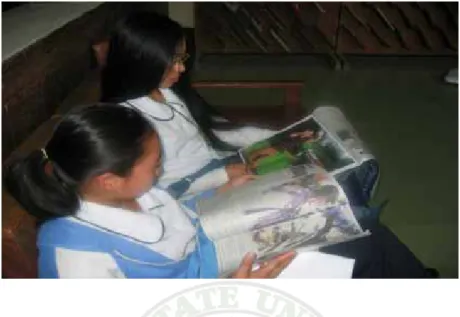 Figure 6. Students reading newspapers in the library 