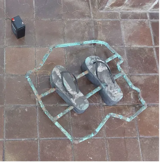 Figure 6: Moore 2020. Concrete Sandals. Life size. Concrete, copper pipes, acid