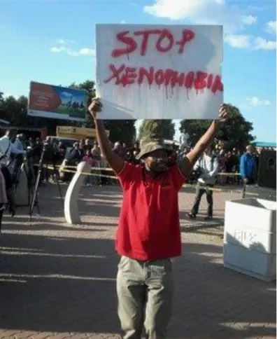 Fig 5.2. Man holding a placard at the anti-xenophobia march 