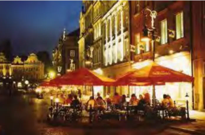 Figure 2.12:  Evening activity, such as the street cafe above, creates  natural surveillance through activity which in turn creates a safer 