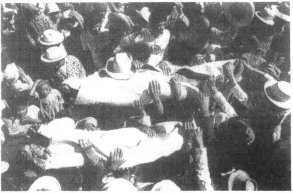 Figure 3: Exhumation in Imerina, the central region of Madagascar. People  lifted high the bodies of the razana and dancing following the rhythm of music 