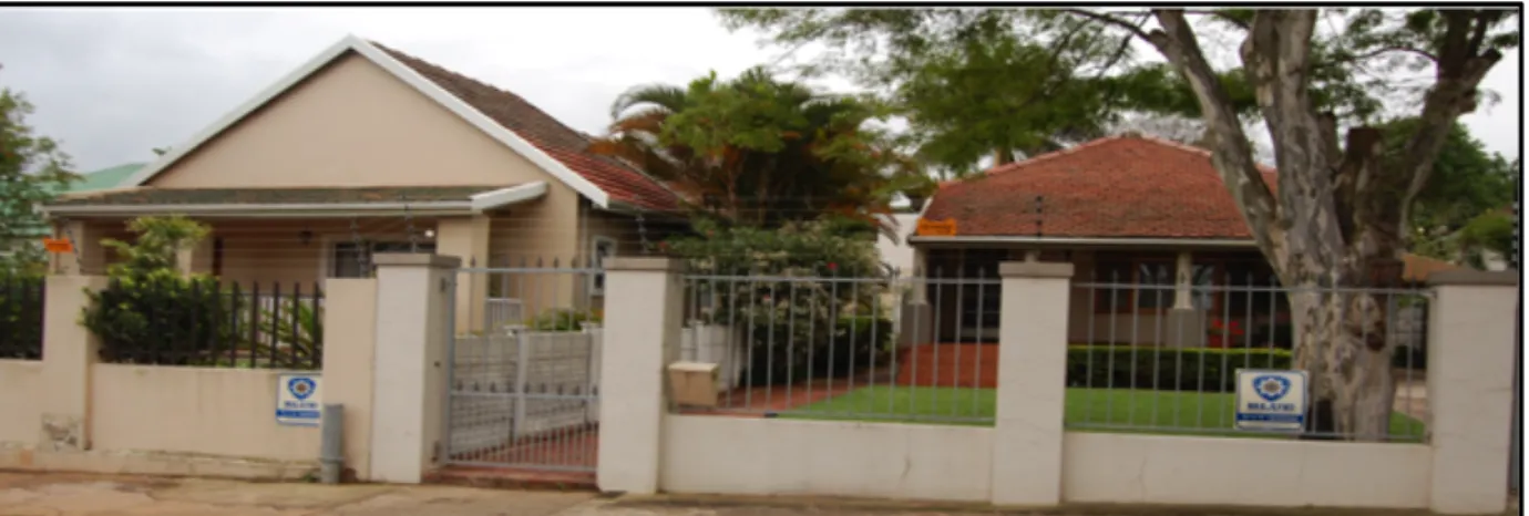 Figure  13:  Two  homes  in  lower  Glenwood.  Brick  columns  are  placed  at  various  intervals  with  a  palisade  fence  connecting  them